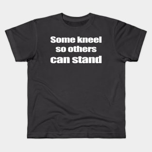 Some kneel so others can stand Kids T-Shirt